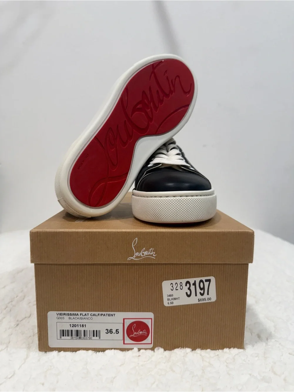Women’s Christian Louboutin Black and White Low-Top Sneakers with Red Sole